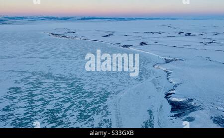 Aerial view of Lockhart Point on the frozen Kotzebue Sound in the Alaskan arctic in the winter Stock Photo