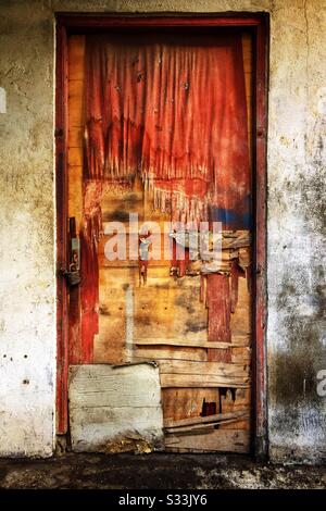 Weathered plywood door in Candidasa, Bali, Indonesia Stock Photo