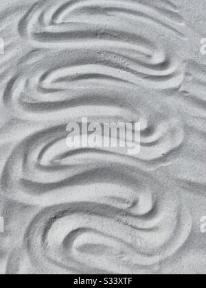 Abstract of curvy patterns in the sand Stock Photo