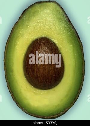 Half of an avocado on a duck egg blue background.  Healthy fat avocado halve.  Cut avocado close up. Stock Photo