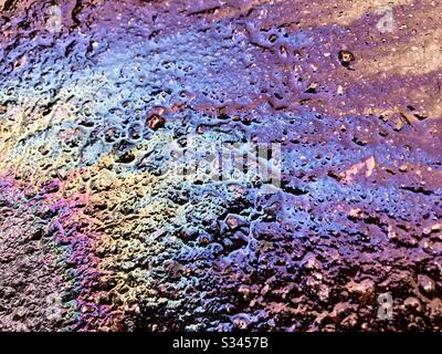 Oil spilled on pavement. Stock Photo