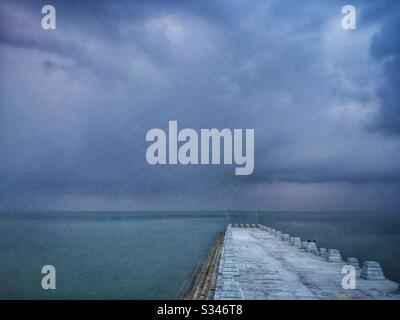 A morning rain squall over the ocean at Batu Ferringhi, Penang, Malaysia Stock Photo