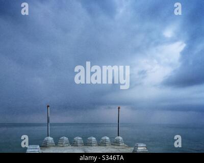 A morning rain squall over the ocean at Batu Ferringhi, Penang, Malaysia Stock Photo