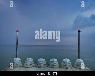 A morning rain squall over the ocean at Batu Ferringhi, Penang, Malaysia Stock Photo