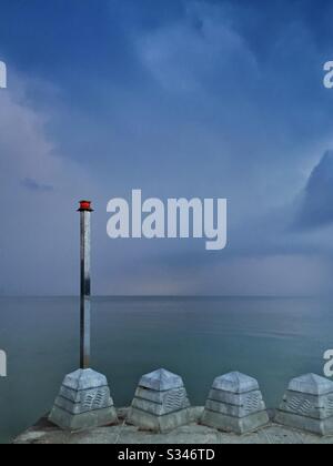 A morning rain squall over the ocean at Batu Ferringhi, Penang, Malaysia Stock Photo