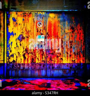 A rusting painted garage door in Batu Ferringhi, Penang, Malaysia Stock Photo