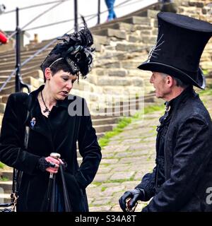 People in creative costumes during a cosplay event. Whitby Goth Weekend. Stock Photo