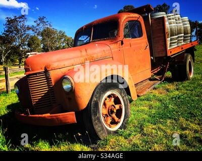 An old, disused International truck marks the entrance to a small vineyard in the Megalong Valley, to the west of the Blue Mountains, NSW, Australia Stock Photo
