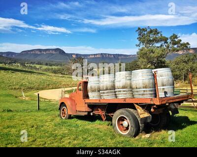 An old, disused International truck marks the entrance to a small vineyard in the Megalong Valley, below the western escarpment of of the Blue Mountains, NSW, Australia Stock Photo