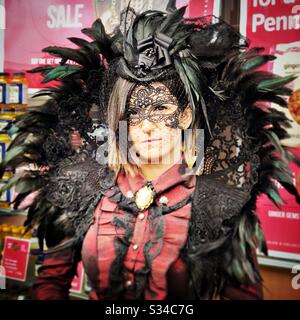 Person in a creative costume during a cosplay event. Whitby Goth Weekend. Confident girl in vintage outfit Stock Photo