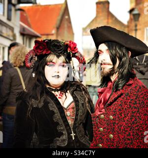 People in creative costumes during a cosplay event. Whitby Goth Weekend. Stock Photo