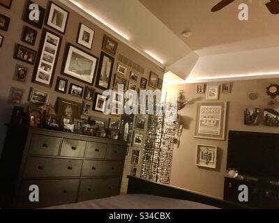 Brown bedroom with lots of photos Stock Photo