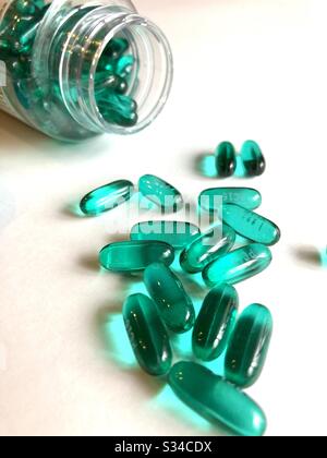 Ibuprofen gel caps on a white background Stock Photo