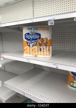 Burnaby, BC, Canada.  March 13, 2020.  Package of paper towels sitting on almost empty shelves in a Vancouver area drug store.  All of the toilet paper and most paper products are sold out. Stock Photo