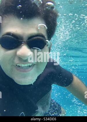 Underwater selfie of a man in clear waters of Bali Stock Photo