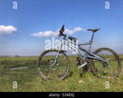 Mountain bike in a field in West Yorkshire Stock Photo