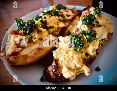 Scrambled eggs on toast for two, homemade healthy breakfast Stock Photo