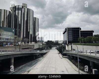 LOS ANGELES, CA, MAR 2020: looking west on empty 4th Street during coronavirus 'stay at home' orders. Downtown YMCA and Westin Bonaventure hotel on left. Stock Photo