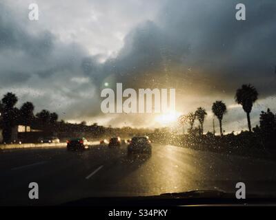 Looking down the highway at the sunset after rain. Stock Photo