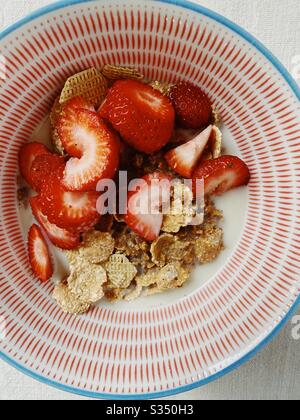 Healthy grain cereal with strawberries and oat milk Stock Photo