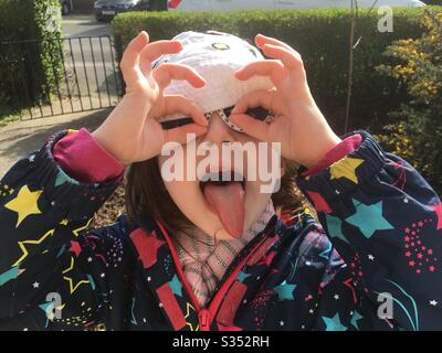 Young girl pulling a funny face Stock Photo