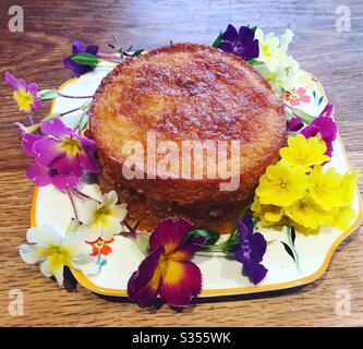 Easter cake with flowers on a vintage plate Stock Photo