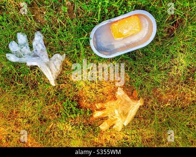 Disposable plastic gloves, soap and water used to wash hands in the fight against Coronavirus Stock Photo