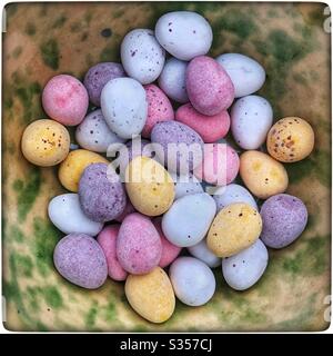 Closeup of chocolate mini Easter eggs in a bowl. Stock Photo