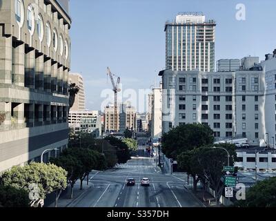 LOS ANGELES, CA, MAR 2020: view west on 4th St with base of 2 Cal Plaza skyscraper on left, plus construction of new high-rise buildings behind refurbished older buildings. Stock Photo