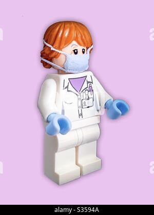 Lego figure doctor or nurse wearing a face mask to protect them from coronavirus or covid-19.  Second lockdown Stock Photo