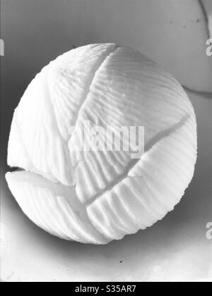 coconut cotyledon-Freshly cracked coconut found inside coconut embryo aka coconut Apple-it was actually ready to shoot some leaves,rich in nutrients,soft spongey & edible,Singapore,black & white Image Stock Photo