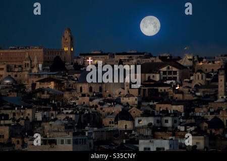 Jerusalem on Good Friday at night. Full moon over the Church of the Holy Sepulchre Stock Photo