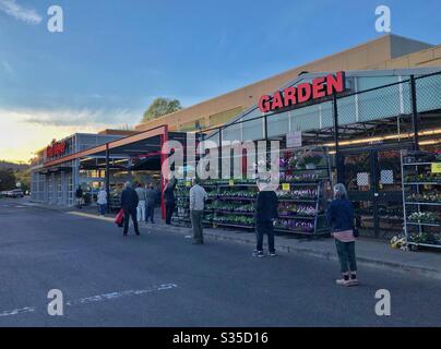 Social distancing at Fred Meyer supermarket in Portland, April 2020 with seniors waiting for 7AM opening for seniors and customers with disabilities during coronavirus pandemic. Stock Photo
