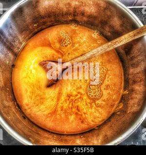 Roasted butternut squash soup homemade in silver saucepan Stock Photo