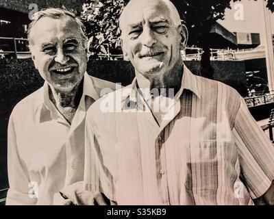 Two senior men strolling London day by River Thames Southbank Centre National Theatre Stock Photo