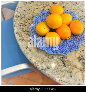 Oranges on kitchen table. Stock Photo