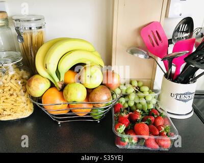 Fruits and pastas on a kitchen work surface Stock Photo