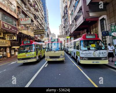 Red minibuses in Mongkok, Hong Kong. Stock Photo