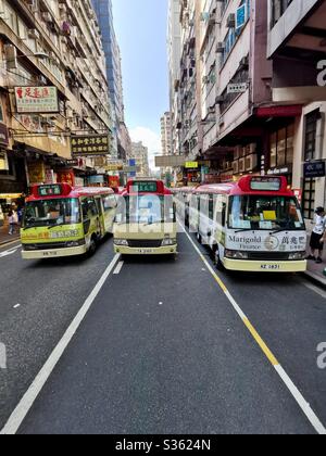 Red minibuses in Mongkok, Hong Kong. Stock Photo