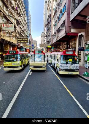 Red minibuses in Mongkok, Hong Kong. Stock Photo