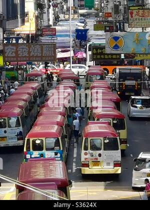 Red minibuses in Mongkok, Hong Kong. Stock Photo