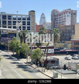 LOS ANGELES, CA, APR 2020: Downtown view looking past Grand Central Market towards City Hall, security camera on pole in foreground Stock Photo