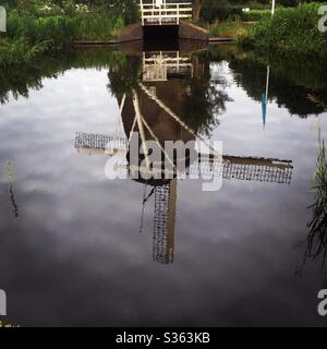 Reflection of a windmill in the water Stock Photo