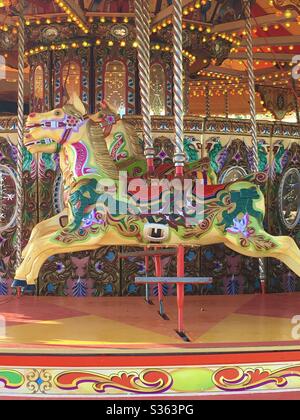 Fairground merry-go-round on Brighton beach, England Stock Photo