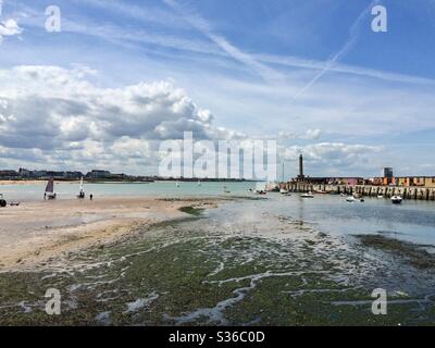 Margate Harbour Arm at low tide with dramatic cloud formation Stock Photo