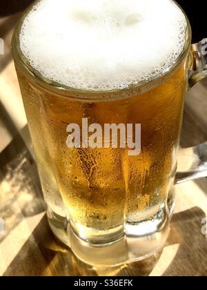 Clear mug of beer Stock Photo