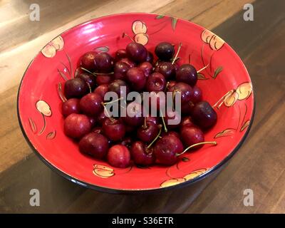 A bowl of red bing cherries in a cherry motif ceramic bowl. Stock Photo