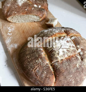 Sourdough loaves in a wooden board Stock Photo