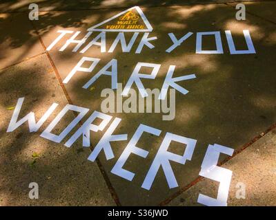 Homemade tape sign thanking park workers at Madison Square, Park in New York City during the coronavirus pandemic, NYC, USA Stock Photo