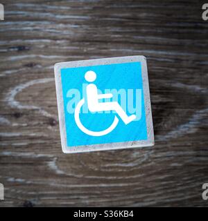 Blue disabled symbol on white background Stock Photo - Alamy